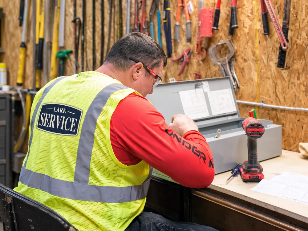 Lark Service electrician at the bench